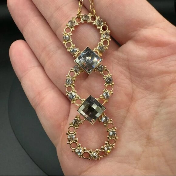 Belladonna Circular Crystal and Gold Tone Infinity Pendant Necklace - Picture 5 of 17